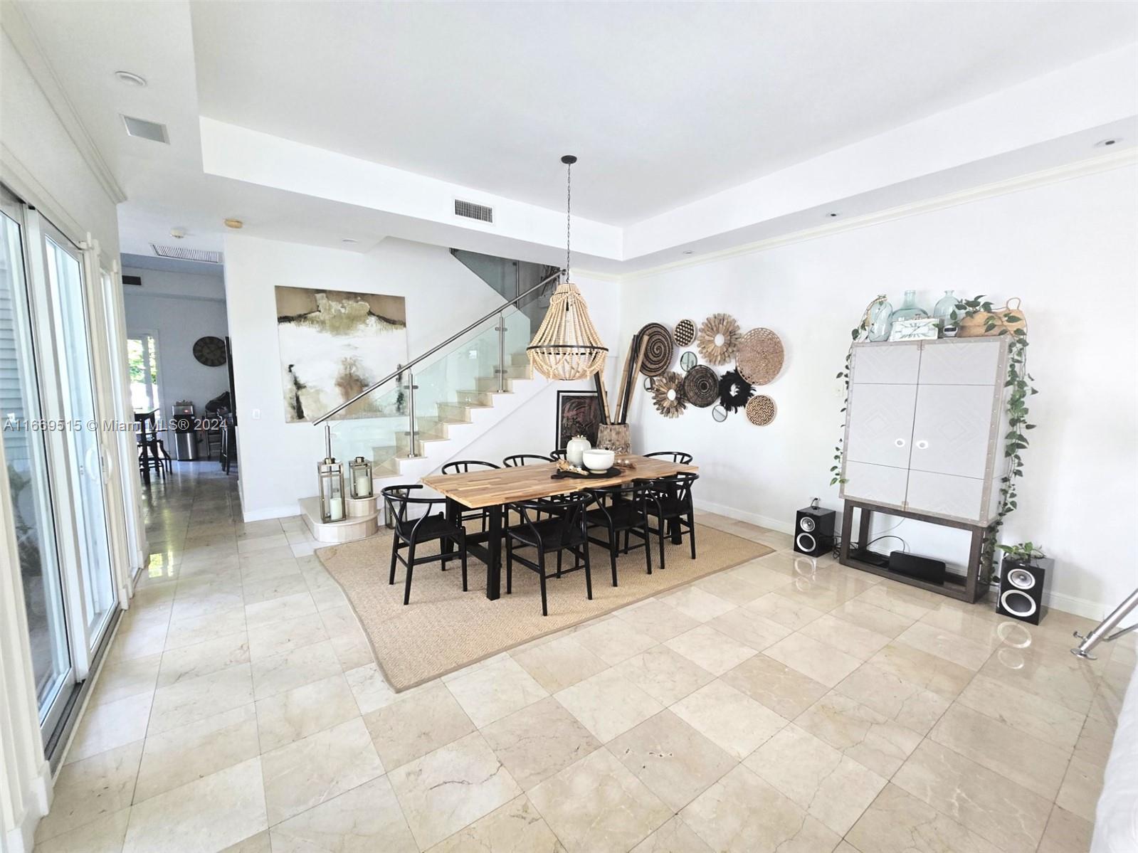 4 Turtle Walk, Unit 4 Key Biscayne, FL 33149 - Photo 9 of 29 a view of a dining area with furniture