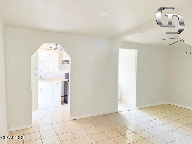 a view of a livingroom with wooden floor and a chandelier