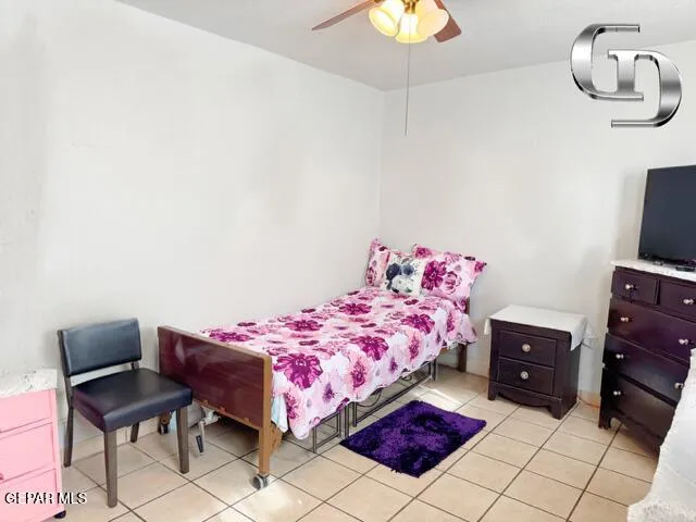 a bedroom with a bed and chair