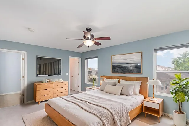 a bedroom with bed and window