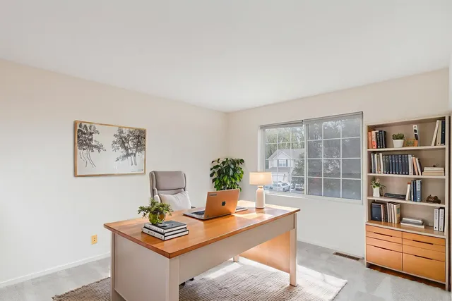 a view of a livingroom with furniture and window