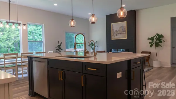 a kitchen with a sink cabinets and window
