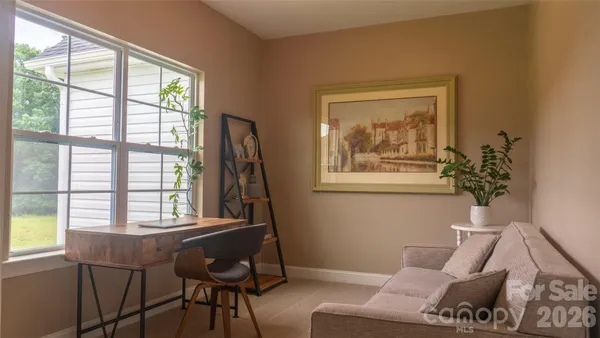 a living room with furniture and a window