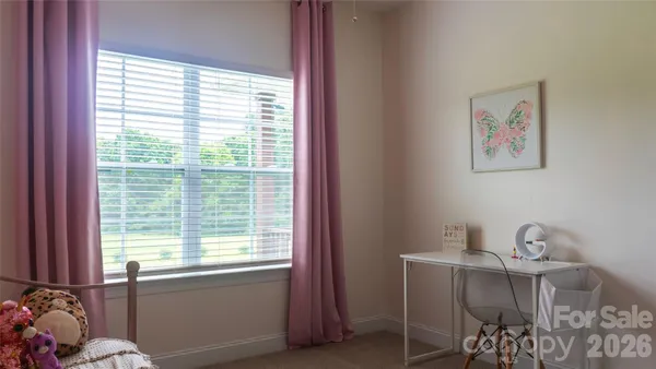 a workspace with furniture and a window