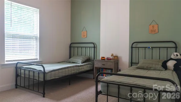 a bedroom with a bed and a table