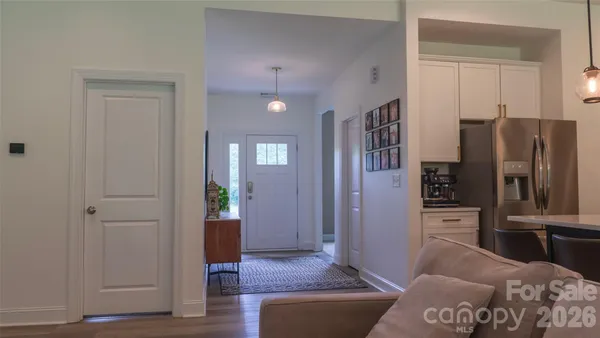a living room with furniture and a walk in closet