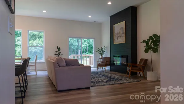 a living room with furniture and a large window