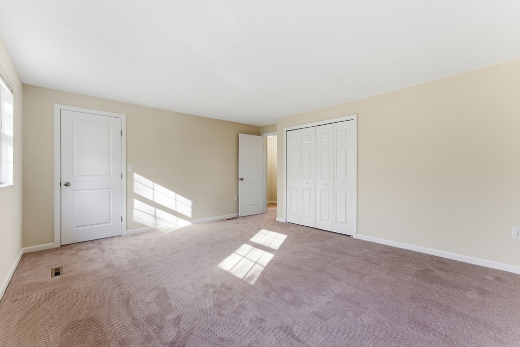 84 Fuller Street, Unit 1 Ludlow, MA 01056 - Photo 17 of 34 a view of an empty room and window