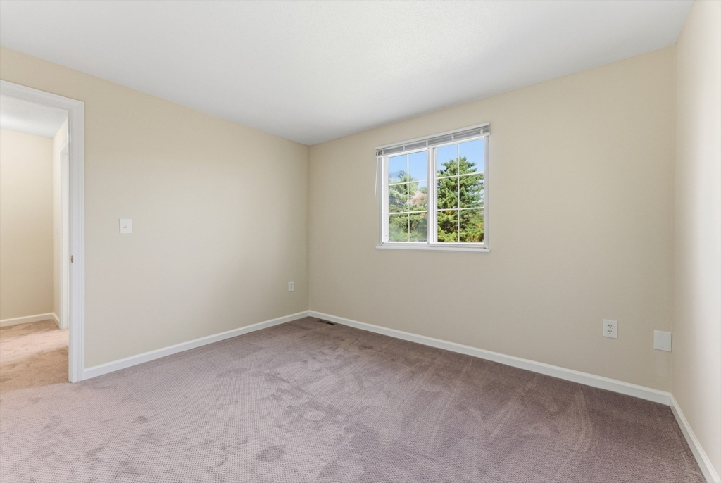 84 Fuller Street, Unit 1 Ludlow, MA 01056 - Photo 21 of 34 an empty room with a window