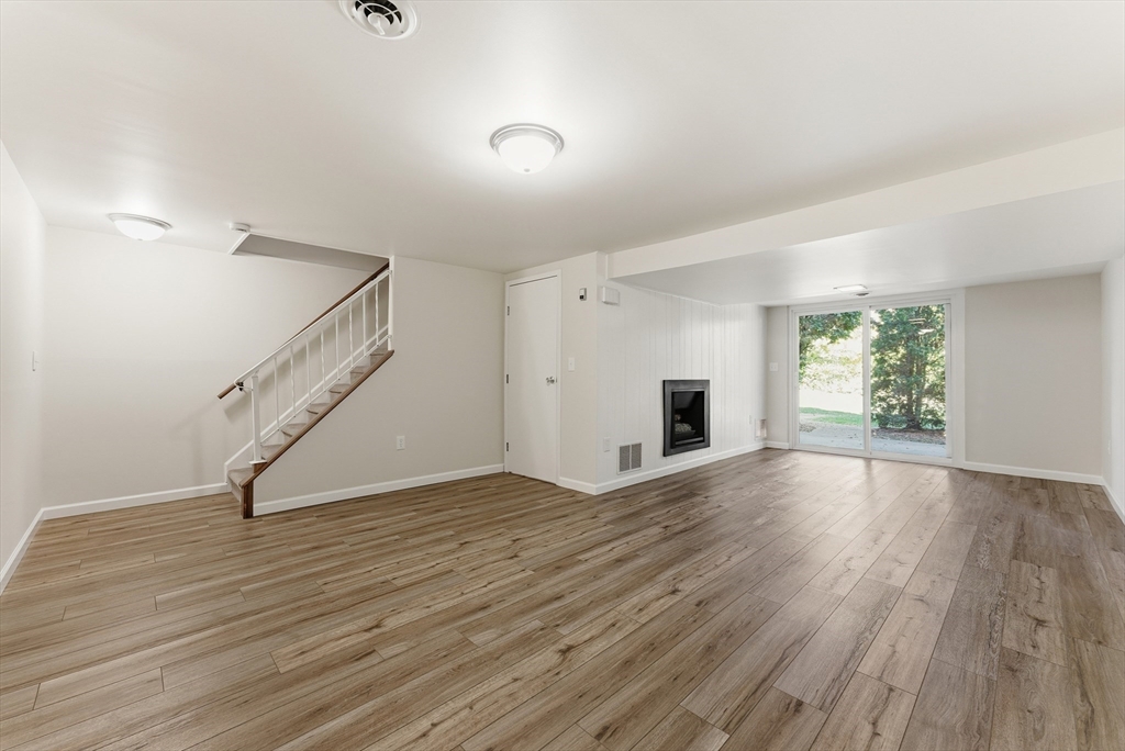 84 Fuller Street, Unit 1 Ludlow, MA 01056 - Photo 27 of 34 wooden floor in an empty room with a window