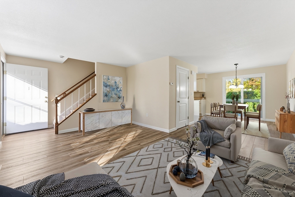 84 Fuller Street, Unit 1 Ludlow, MA 01056 - Photo 5 of 34 a bedroom with furniture and a wooden floor