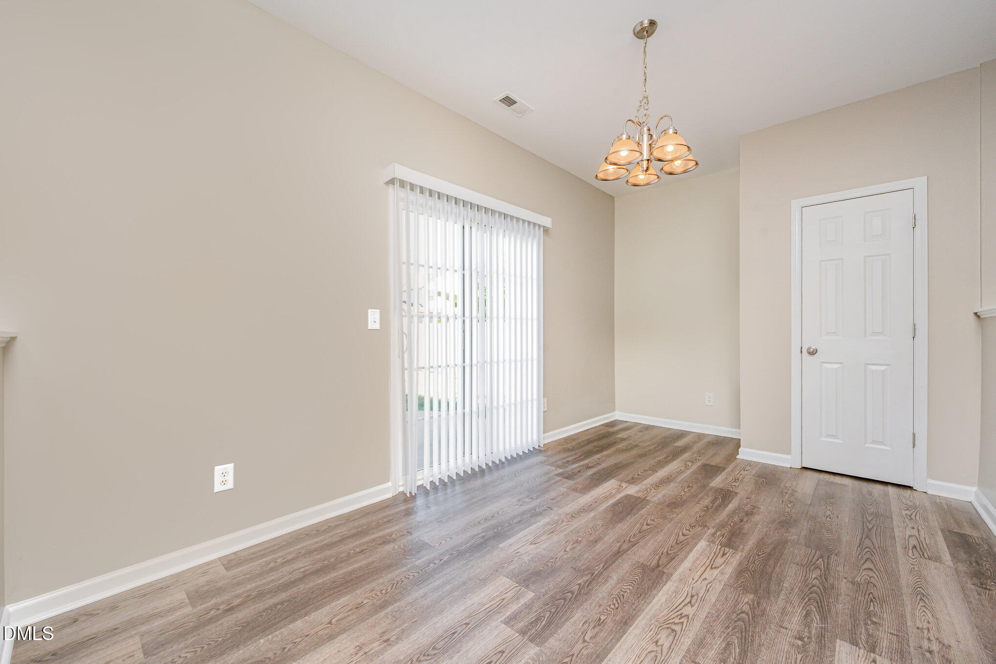1508 Bancroft Court Graham, NC 27253 - Photo 12 of 33 wooden floor in an empty room with a window