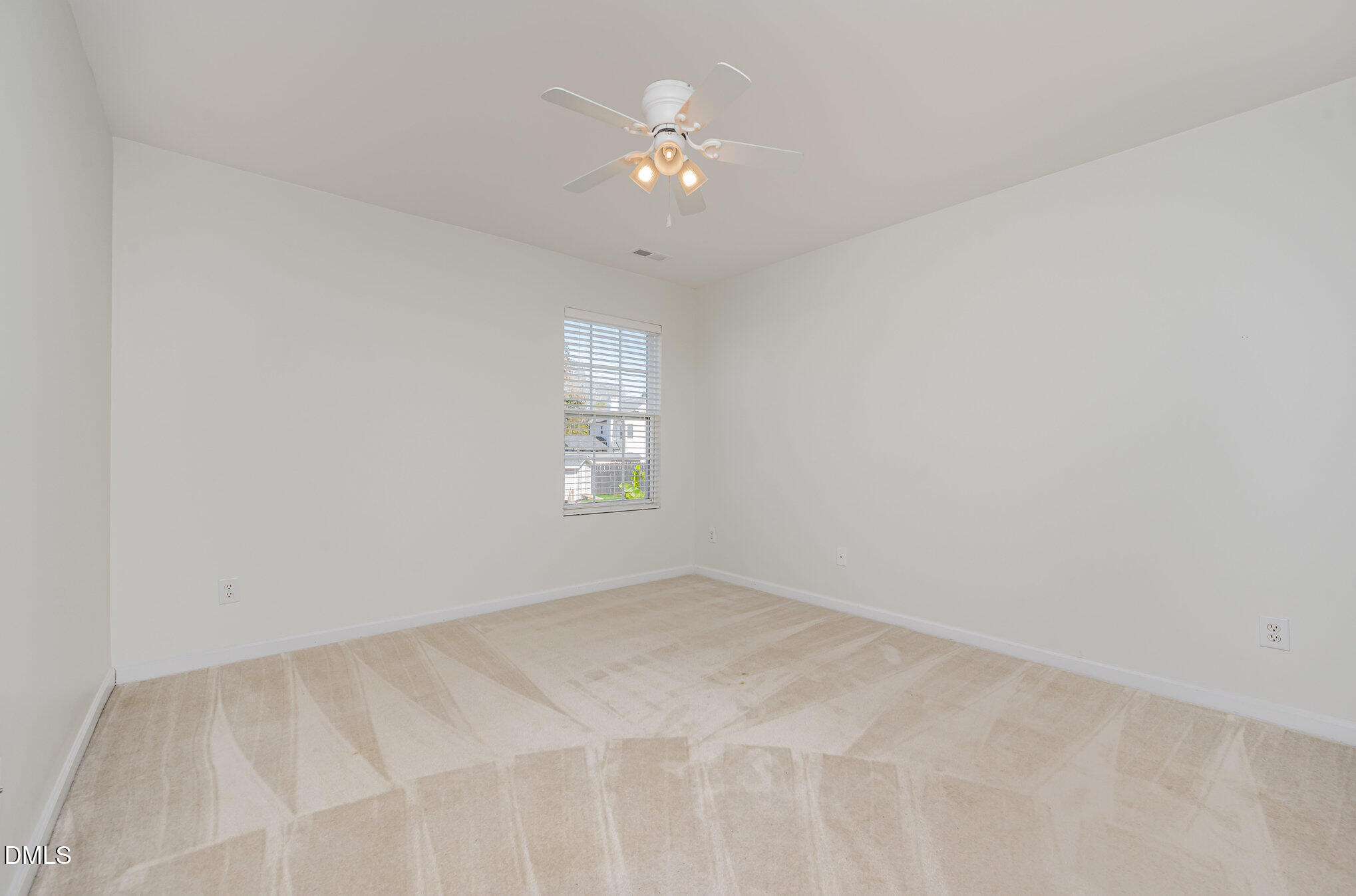 1508 Bancroft Court Graham, NC 27253 - Photo 21 of 33 an empty room with a window and a ceiling fan