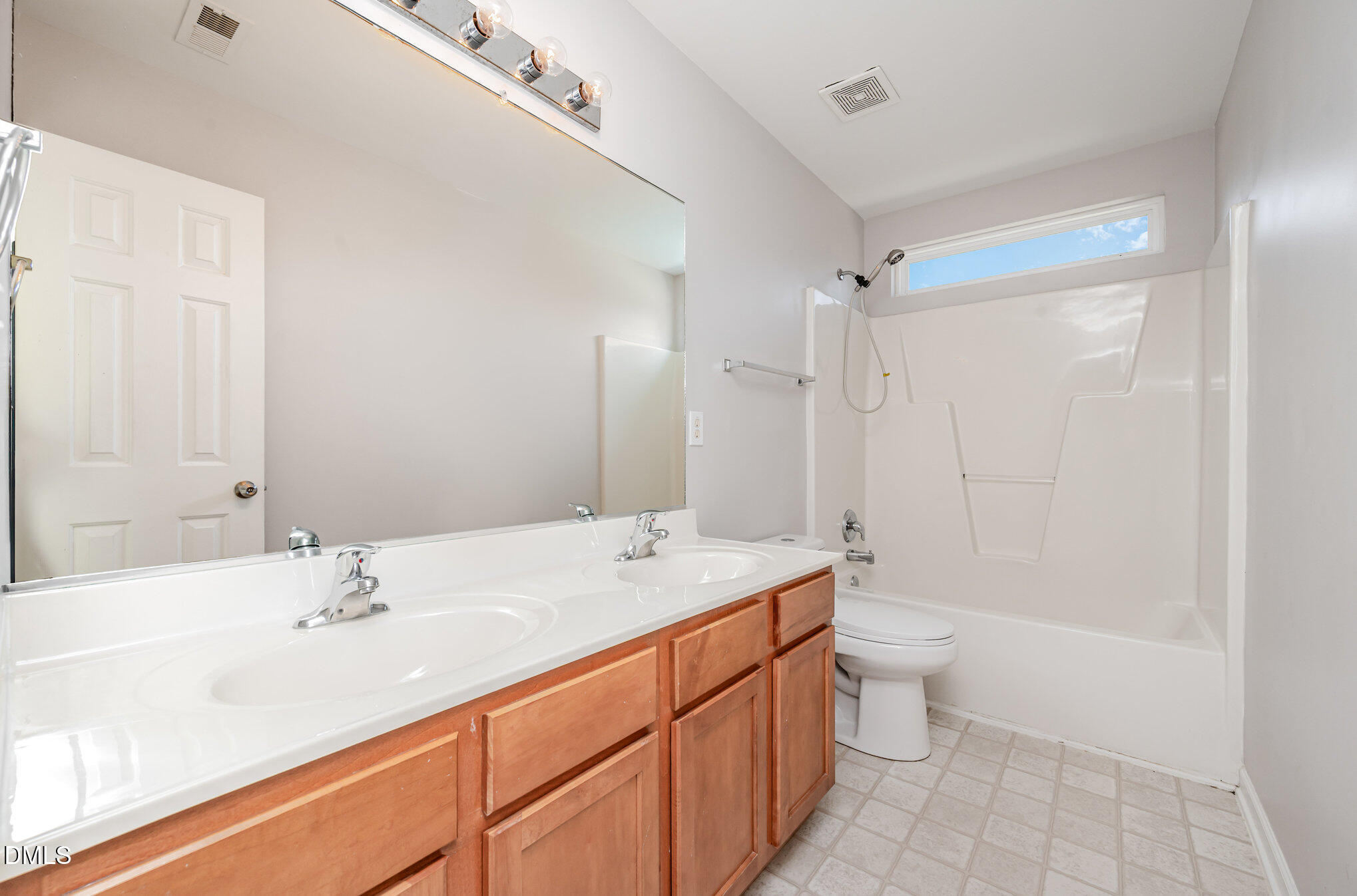 1508 Bancroft Court Graham, NC 27253 - Photo 23 of 33 a bathroom with a sink a toilet a shower and a mirror