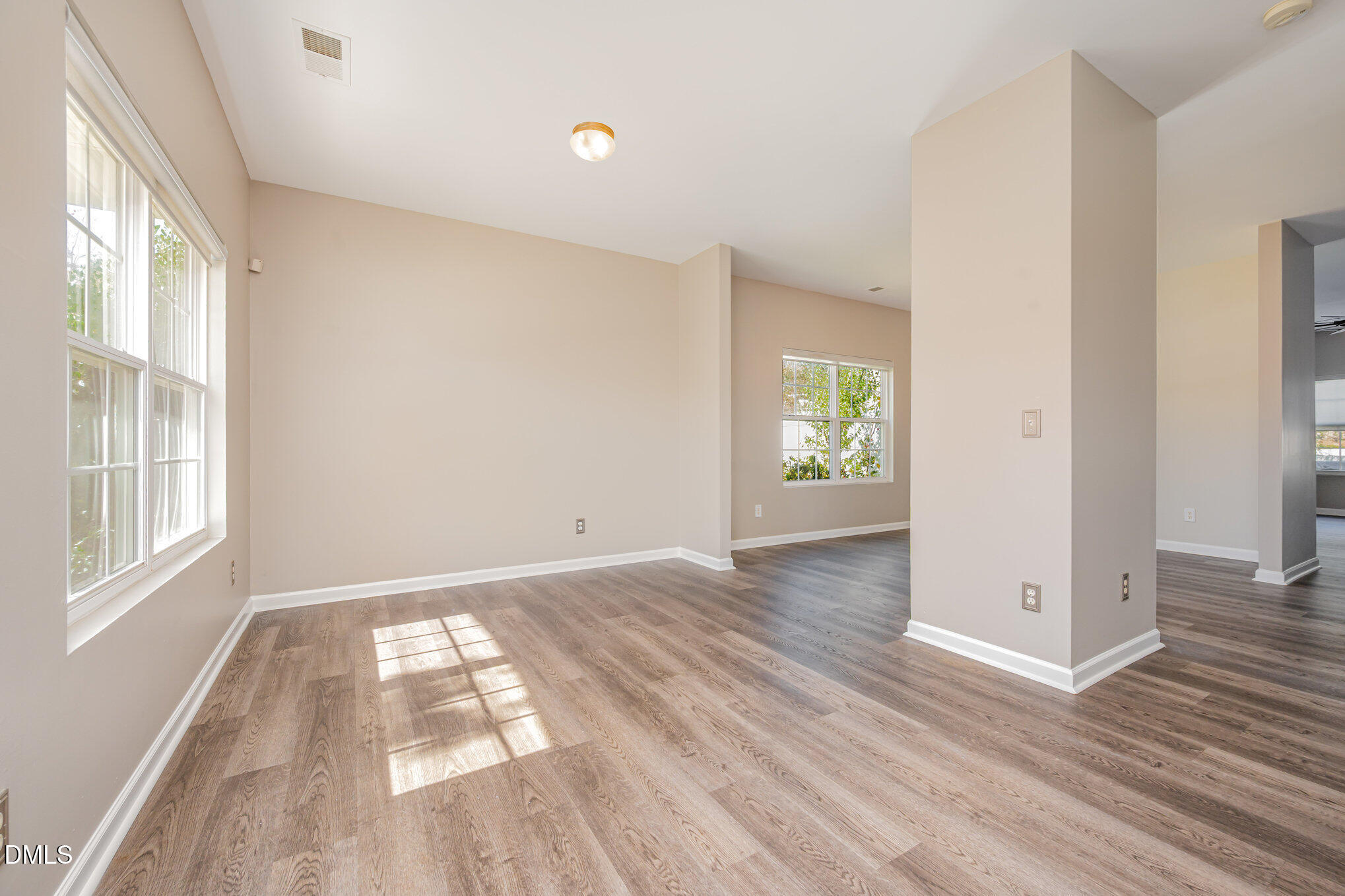 1508 Bancroft Court Graham, NC 27253 - Photo 4 of 33 an empty room with wooden floor and windows