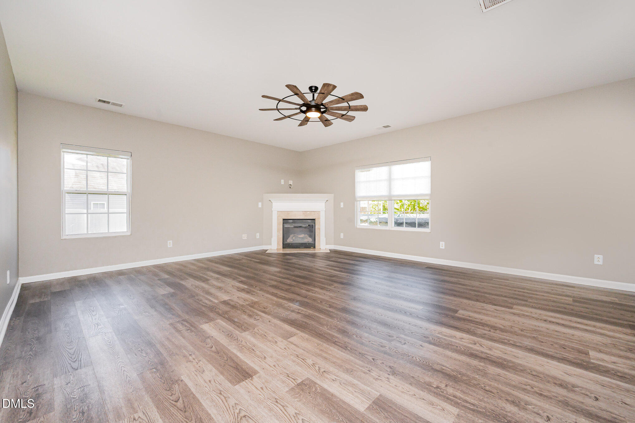 1508 Bancroft Court Graham, NC 27253 - Photo 6 of 33 wooden floor in an empty room with a window