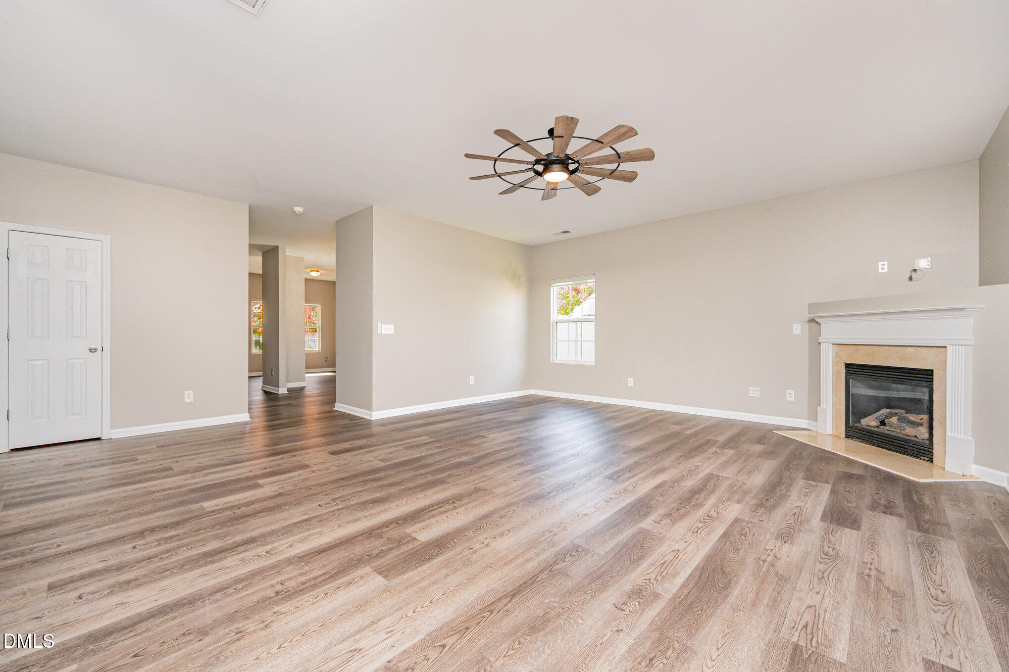 1508 Bancroft Court Graham, NC 27253 - Photo 7 of 33 a view of an empty room with a window and fireplace