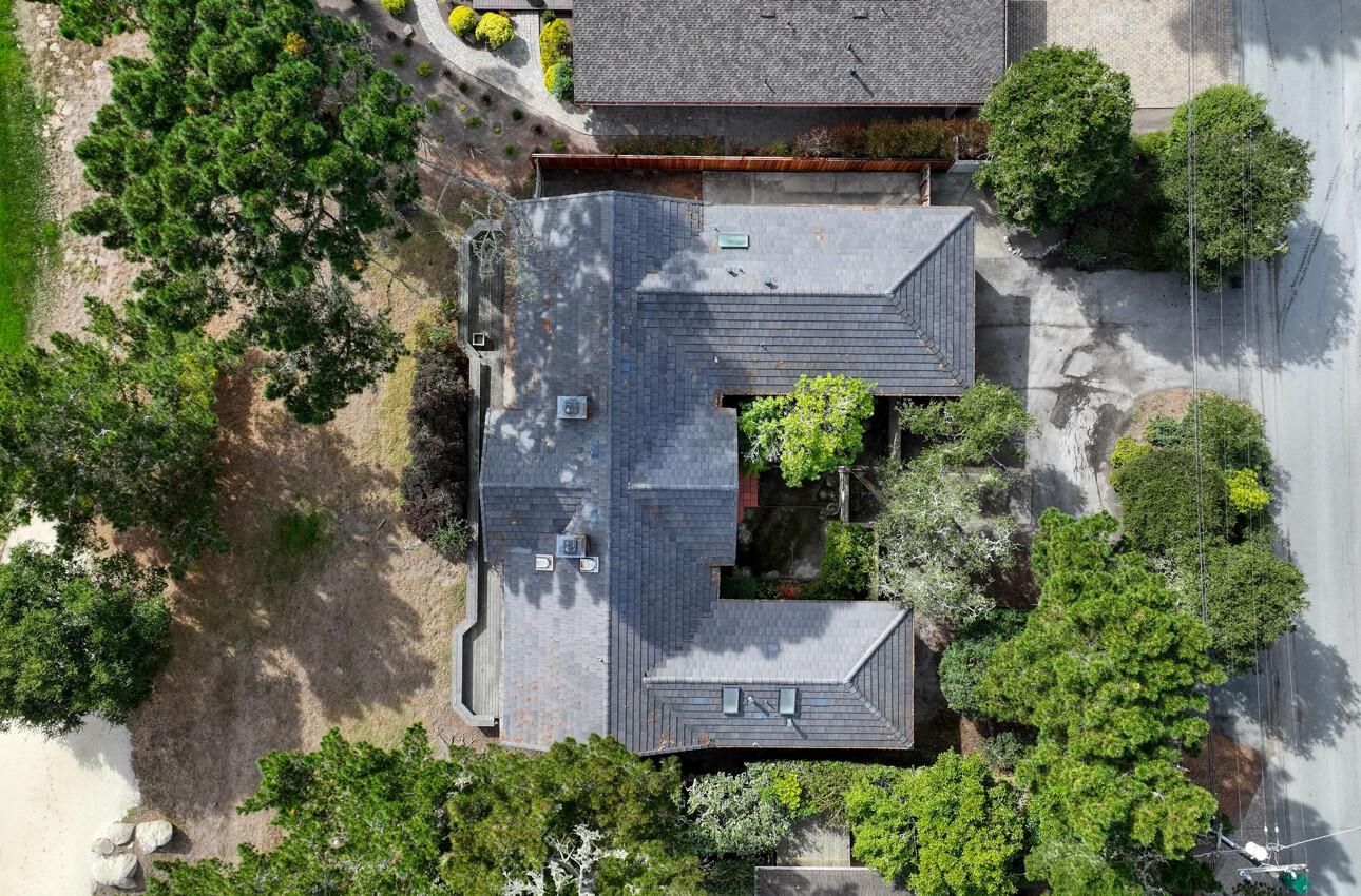 1056 Rodeo Road Pebble Beach, CA 93953 - Photo 16 of 17 an aerial view of a house with outdoor space and a lake view