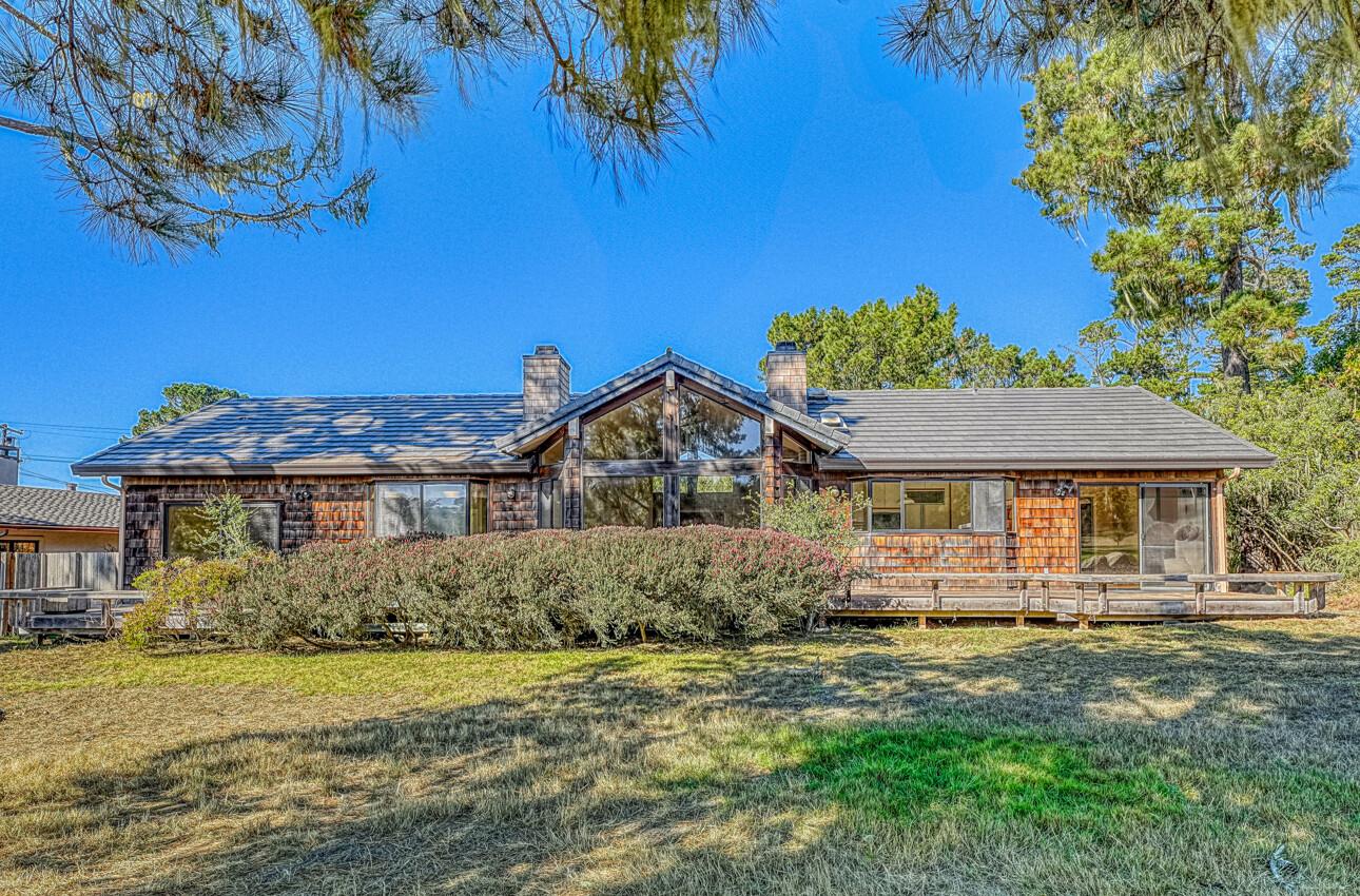 1056 Rodeo Road Pebble Beach, CA 93953 - Photo 2 of 17 a front view of a house with a garden