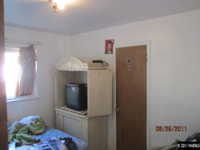1425 Castle Way Reno, NV 89512 - Photo 2 of 7 a kitchen with a refrigerator and cabinets