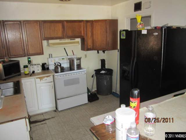 1425 Castle Way Reno, NV 89512 - Photo 5 of 7 a kitchen with a sink appliances and cabinets