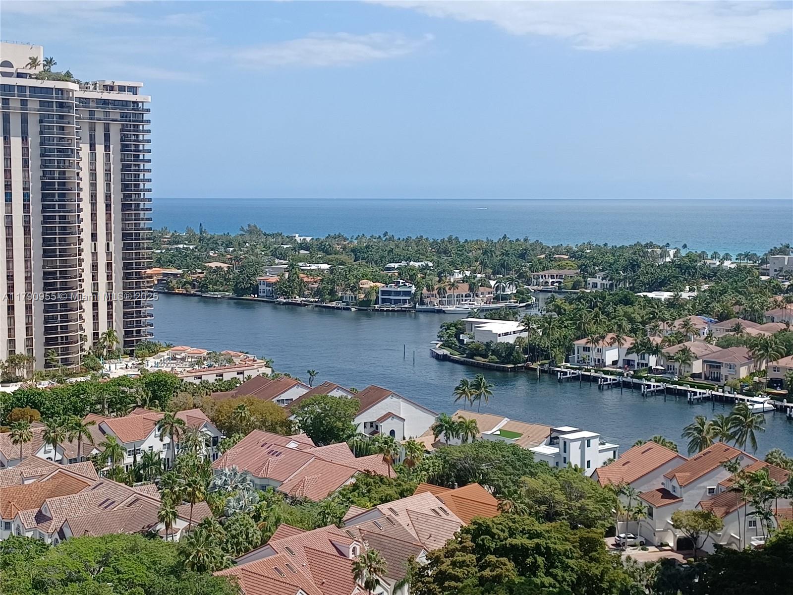 Biscayne Yacht and Country Club Aventura, FL 33180 - Photo 1 of 22 an aerial view of a city with lake view and mountain view in back