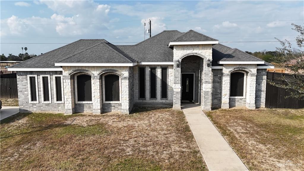a front view of a house with a yard