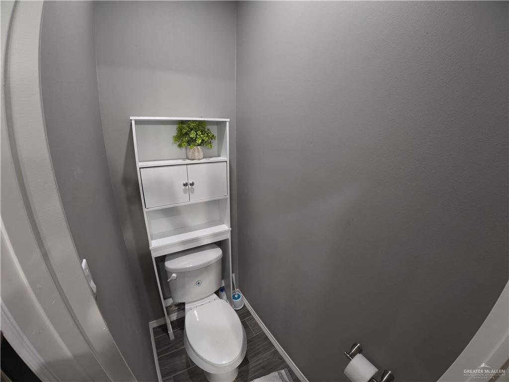 321 Gladiola Drive Edcouch, TX 78538 - Photo 12 of 29 a white toilet sitting next to a shower