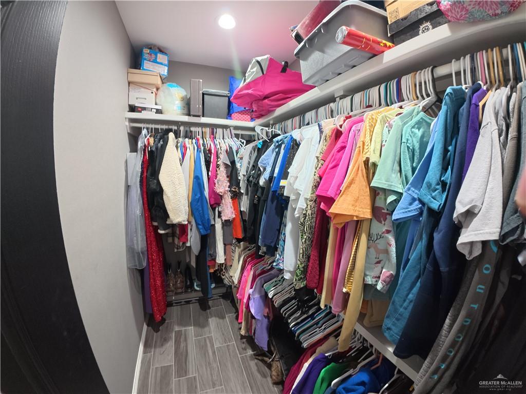 321 Gladiola Drive Edcouch, TX 78538 - Photo 13 of 29 a view of walk in closet with clothes