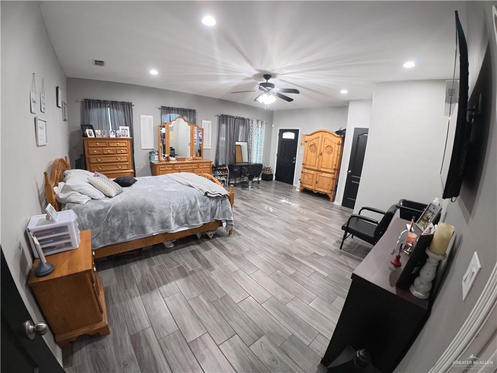 321 Gladiola Drive Edcouch, TX 78538 - Photo 17 of 29 a bedroom with furniture and a wooden floor