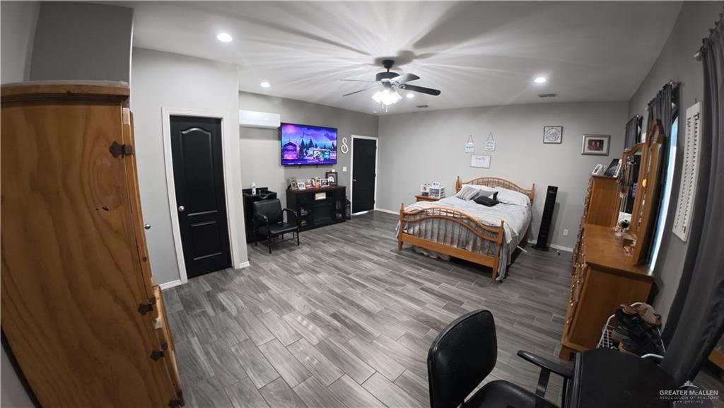321 Gladiola Drive Edcouch, TX 78538 - Photo 18 of 29 a bedroom with furniture and a flat screen tv