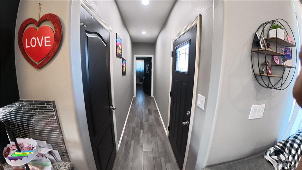 321 Gladiola Drive Edcouch, TX 78538 - Photo 5 of 29 a view of a hallway with wooden floor and entryway