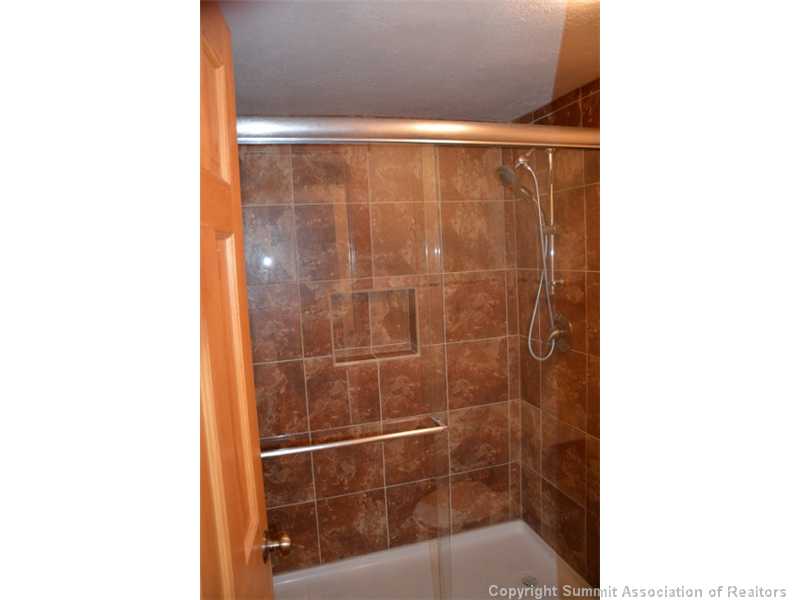 88 Guller Road, Unit 406 Frisco, CO 80443 - Photo 13 of 25 Bathroom. All new tile shower with cast iron shower pan.
