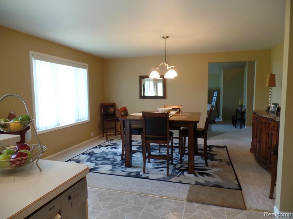 6340 Vassar Road Grand Blanc, MI 48439 - Photo 19 of 51 The formal dining room (directly adjacent to the kitchen) offers enough space for even the largest of tables, and is the perfect spot for formal entertaining and gatherings.