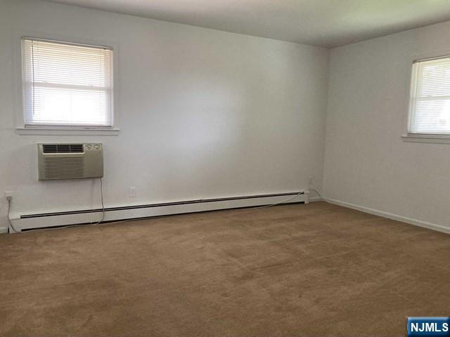 2430 6th Street, Unit 2 Fort Lee, NJ 07024 - Photo 11 of 15 an empty room with a empty space and window