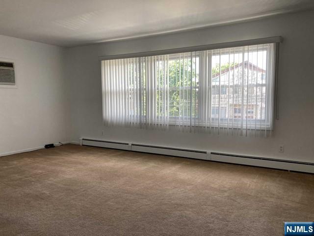 2430 6th Street, Unit 2 Fort Lee, NJ 07024 - Photo 4 of 15 an empty room with a window