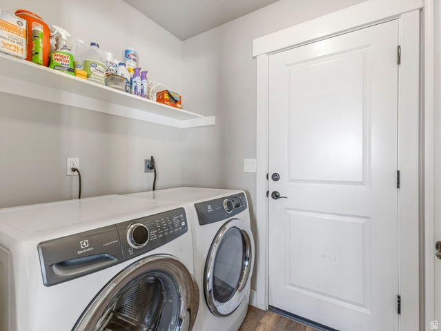 573 South Maxwell Drive Grantsville, UT 84029 - Photo 19 of 25 Laundry room with washer and dryer and dark wood-style flooring