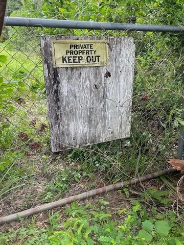 a sign on the side of the road