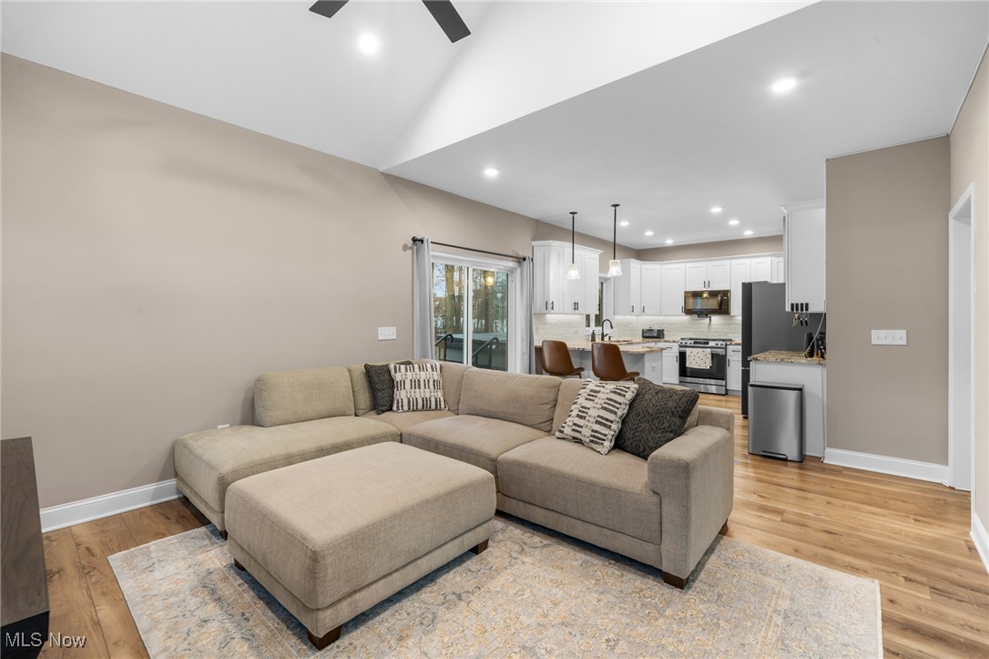 39600 Aurora Road Solon, OH 44139 - Photo 12 of 49 Living area featuring recessed lighting and vaulted ceiling