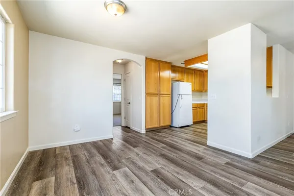 a view of a kitchen with a stove cabinets and wooden floor