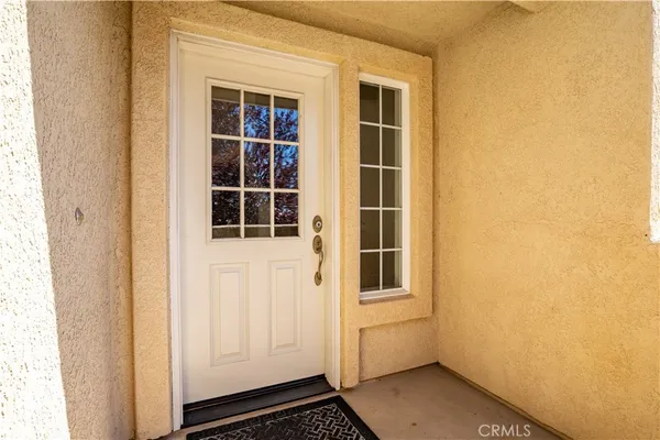 a view of empty room with wooden floor and fireplace