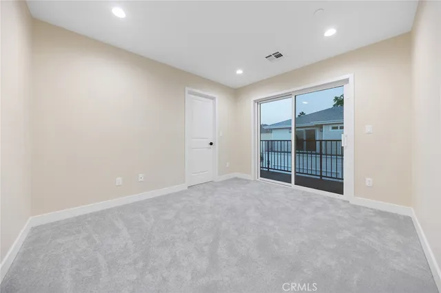 a bathroom with a granite countertop sink a toilet and shower