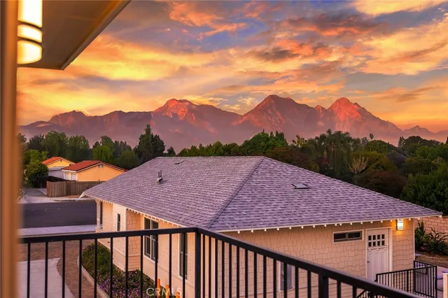 an empty room with a ceiling fan and window