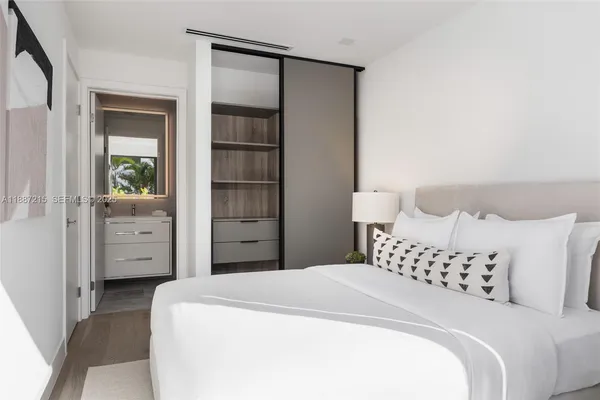 a bedroom with a bed and a cabinets