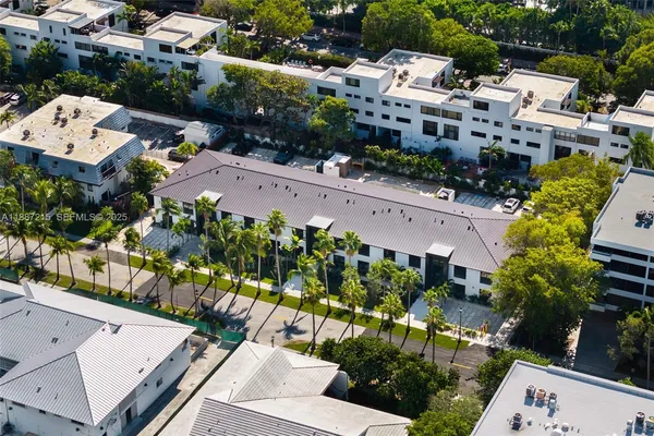 an aerial view of a house with a garden