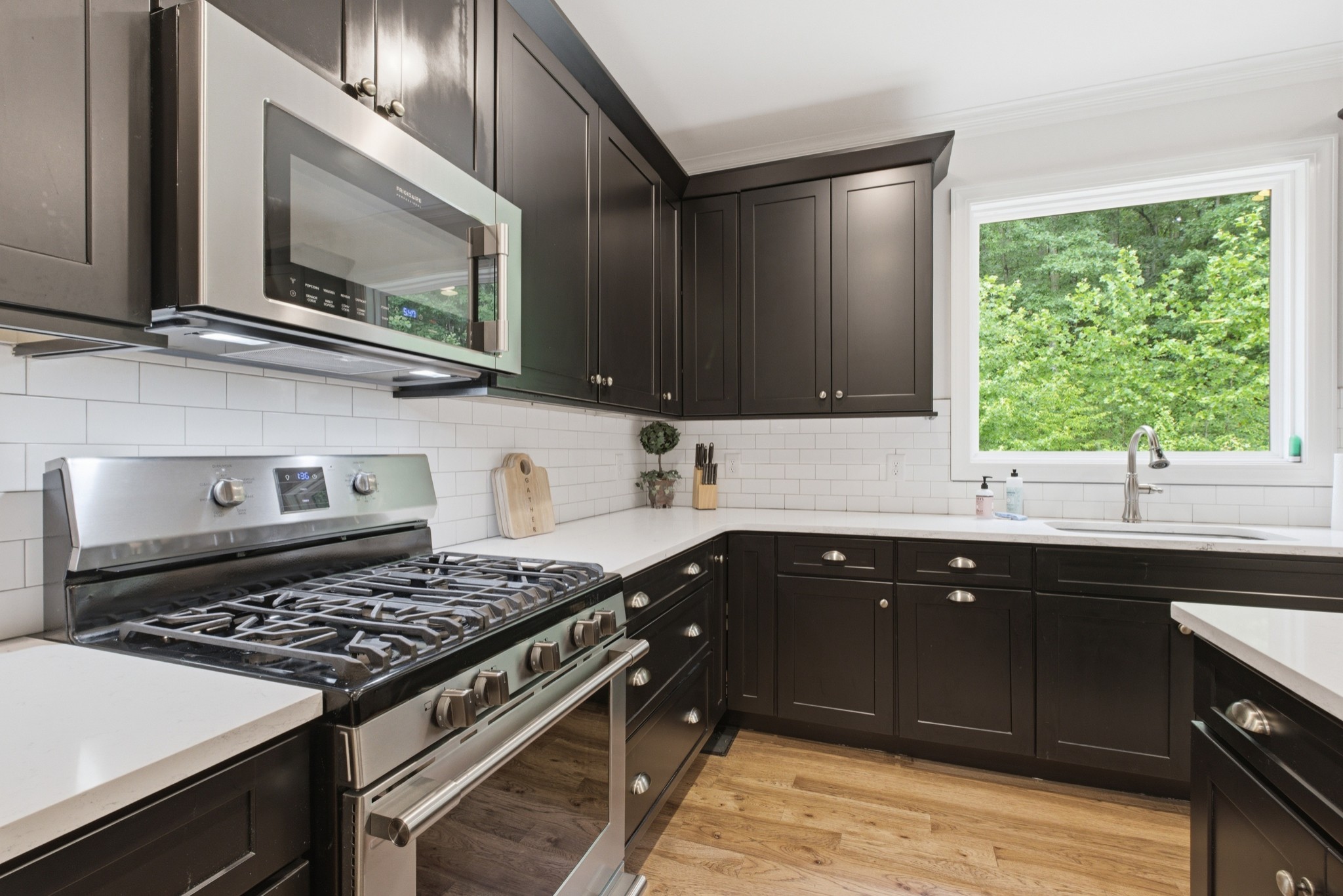 7075 Pinewood Road Nunnelly, TN 37137 - Photo 21 of 49 a kitchen with a sink stove and microwave