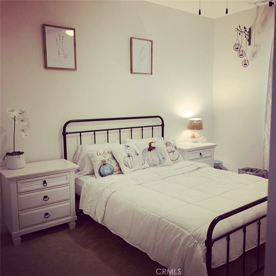 2017 Tango Loop, Unit 1 Chula Vista, CA 91915 - Photo 11 of 32 a bedroom with a bed and a window