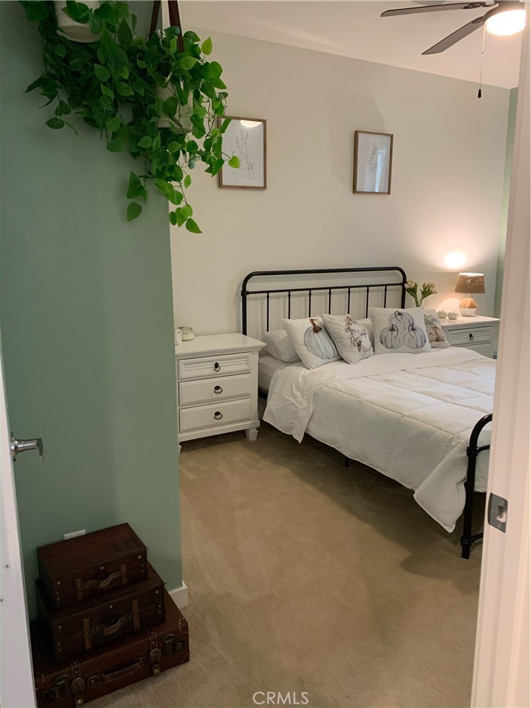 2017 Tango Loop, Unit 1 Chula Vista, CA 91915 - Photo 20 of 32 a bedroom with a bed plant and a window