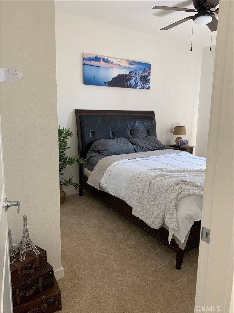 2017 Tango Loop, Unit 1 Chula Vista, CA 91915 - Photo 30 of 32 a bedroom with a bed and wooden floor