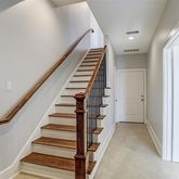 a view of a hallway with staircase